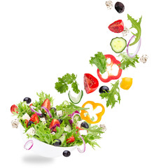 Wall Mural - Fresh salad with flying vegetables ingredients