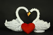 Beautiful white swans origami, love concept, paper handmade, isolated on black background