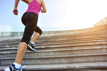 Wall Mural - runner athlete running on stairs
