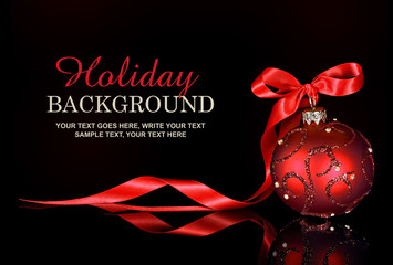 christmas background with a red ornament and ribbon