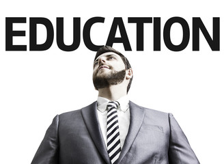 Business man with the text Education in a concept image