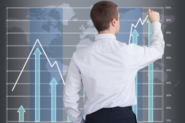 Businessman drawing a graph showing the success of the company