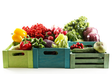 Wall Mural - Fresh organic vegetables in wooden boxes, close up