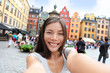 © Maridav - Asian woman taking self portrait selfie Stockholm