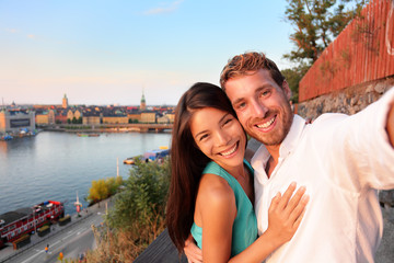 Wall Mural - Couple taking selfie self portrait in Stockholm