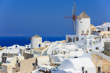 Wall Mural - Windmill at the village of Oia in Santorini, Greece