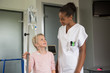 © onoky - Female nurse assisting to a girl patient in hospital