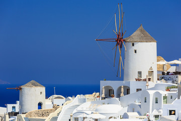 Wall Mural - Windmill at the village of Oia in Santorini, Greece