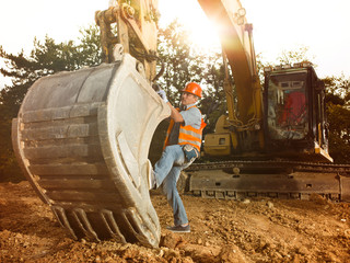 Wall Mural - repairman fixing excavator