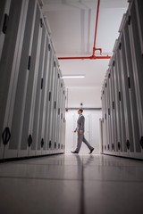 Poster - Technician walking in server hallway