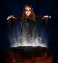 Witch With Cauldron On Blue Rays Background