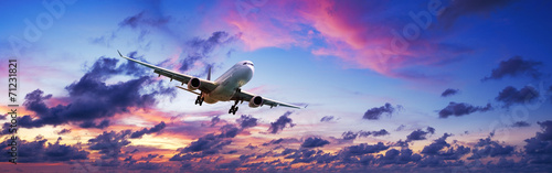 Fotografering  Jet plane in a spectacular sunset sky