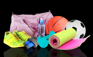 Poster - Sporting goods on black background