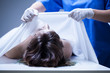 Covering female body in mortuary