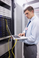 Poster - Technician using laptop while analysing server