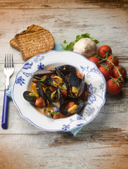 Wall Mural - mussel soup with toasted bread