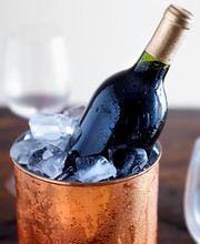 Wine Bottle In Ice Bucket With Glasses
