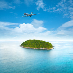 Fototapete - Private jet plane over the tropical island