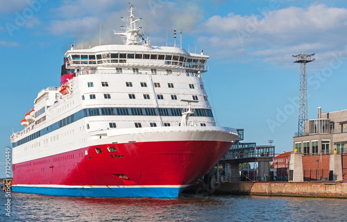 Fotografía Red and white passenger ferry is moored in port