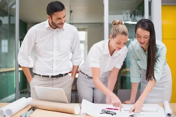 Architecture team working together at desk