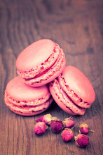 Macaroons With Dry Roses On Retro Vintage Wooden Background