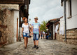 © Xalanx - Mother and son walking on the old street