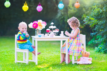 Cute children at doll tea party