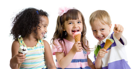 happy kids eating ice cream in studio isolated