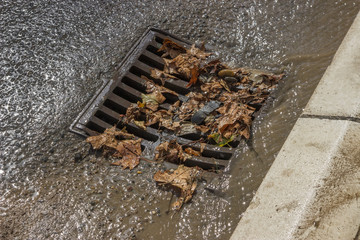 metal storm drain cover after street cleaning