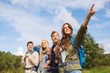 © Syda Productions - group of smiling friends with backpacks hiking