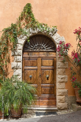 Naklejka ścienna Old door in a Tuscany town, Italy