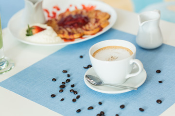 Wall Mural - Cup of latte coffee on blue table