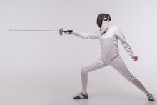 Young Woman Engaging In Fencing
