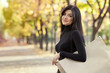 beautiful woman with shopping bag in park