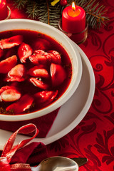 Wall Mural - Christmas red borscht with meat filled dumplings