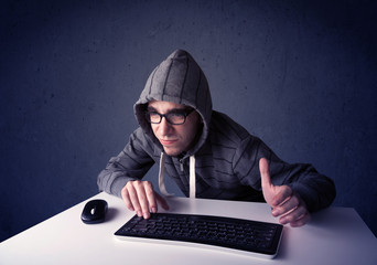 Fototapete - Hacker working with keyboard on blue background