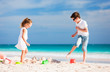 © TravelPhotoBloggers - Two kids playing at beach