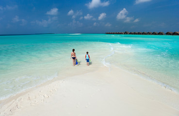 Wall Mural - mother and son at tropical beach