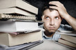 Young Man Overwhelmed and frustrated in education stress concept
