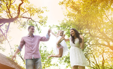 Wall Mural - Pregnant family in garden