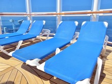  Lounge Chairs On A Cruise Ship Deck Overlooking The Ocean      