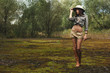 © dmitry_zubarev - safari woman in  the morning swamp