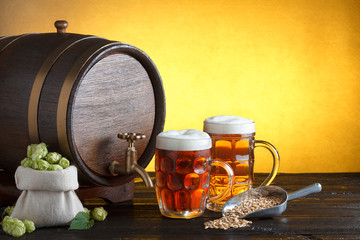 Vintage beer barrel with two beer glasses