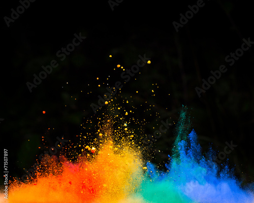 launched colorful powder over black