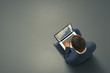 © ArtFamily - man sitting on the dark floor with laptop