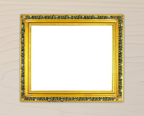 blank golden frame on wood wall