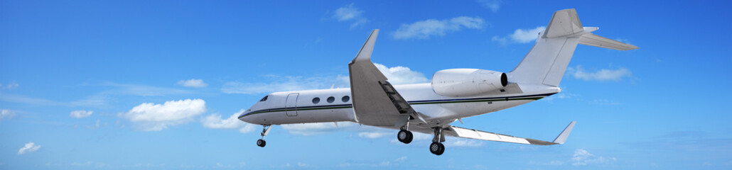 Fototapete - Private jet in a blue sky