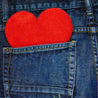 Red heart in a back pocket of a jeans
