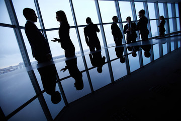 Poster - Silhouettes of business people interacting in board room