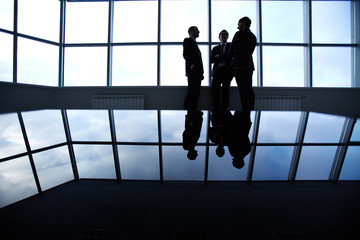 Canvas Print - Three business partners having a discussion